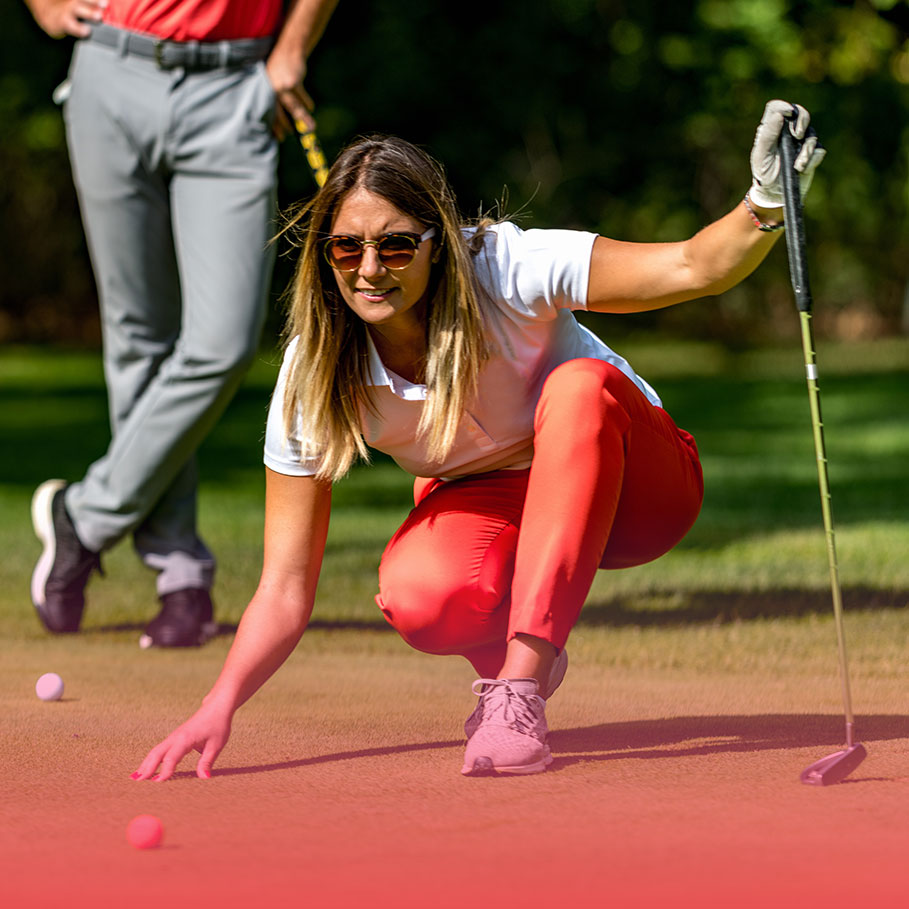 Woman viewing line for putt