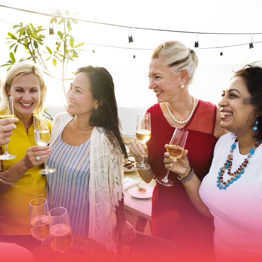 Women socializing and drinking wine
